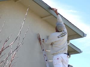 man painting house on ladder - workers’ compensation attorney