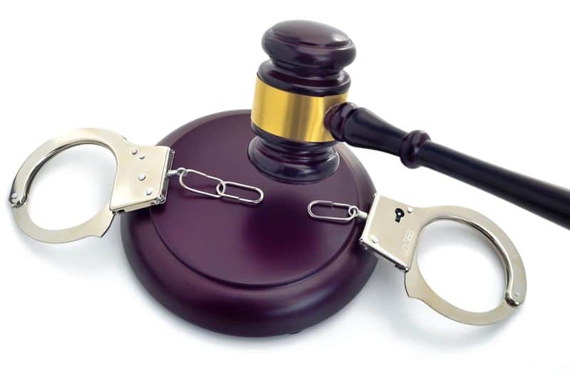 statutory interpretation - gavel and handcuffs