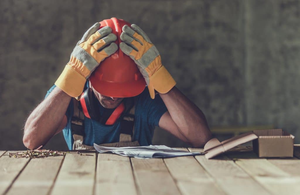 Disappointed Sad Caucasian Contractor Worker Facing Legal Problems. construction accident