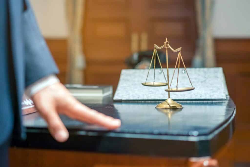 small scales in lawyer's office representing a lawsuit - Riverside attorneys