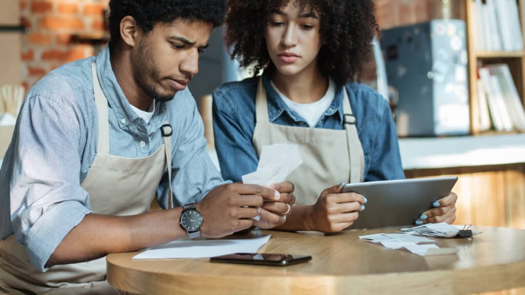 Employees looking at receipts