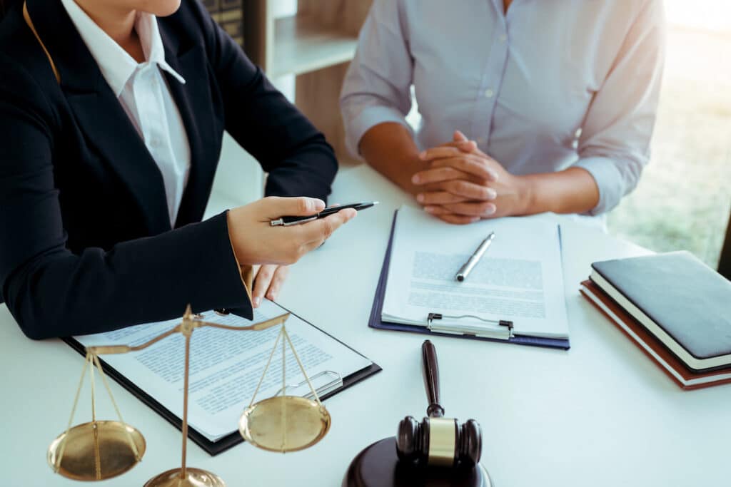 Business attorney and client looking over paperwork