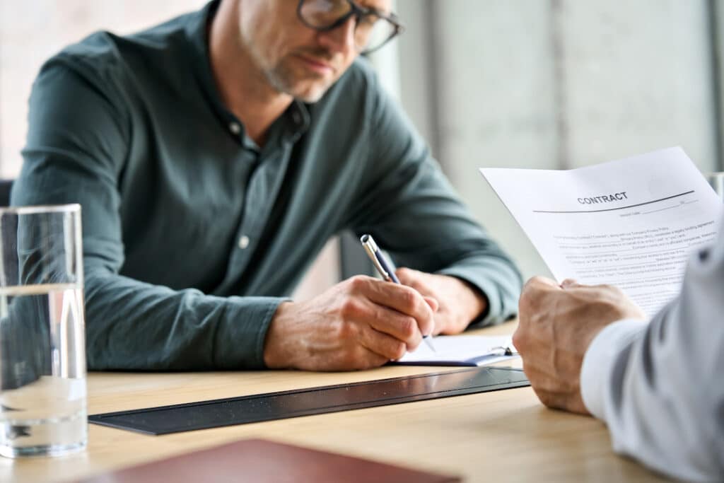 Person signing a contract