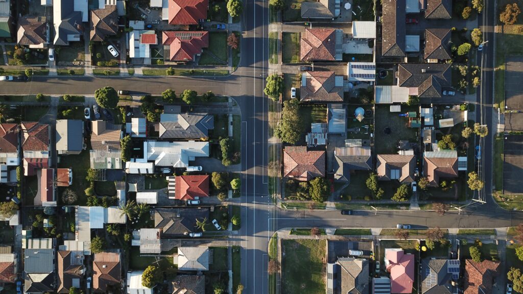 An aerial view of a suburban neighborhood. Knowing the law will help one avoid mortgage fraud.