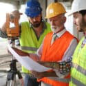 construction workers discussing plans