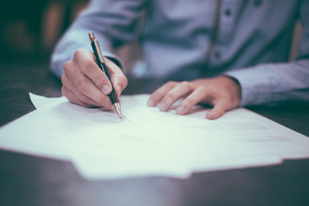 new home owner signing california real estate law contract