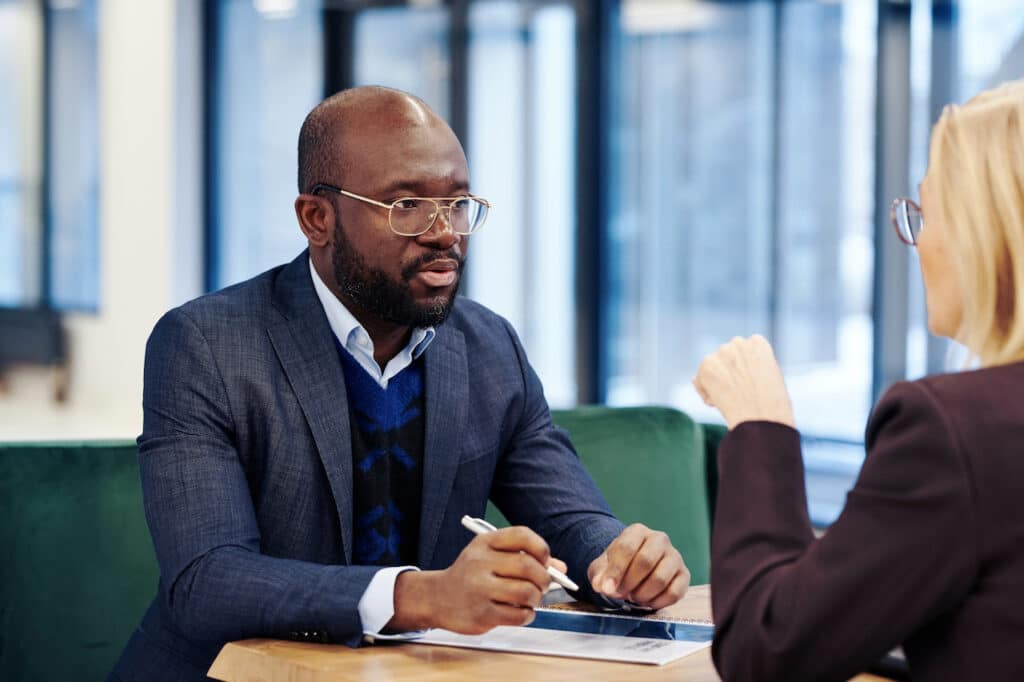 Lawyer talking to business owner about selling a business