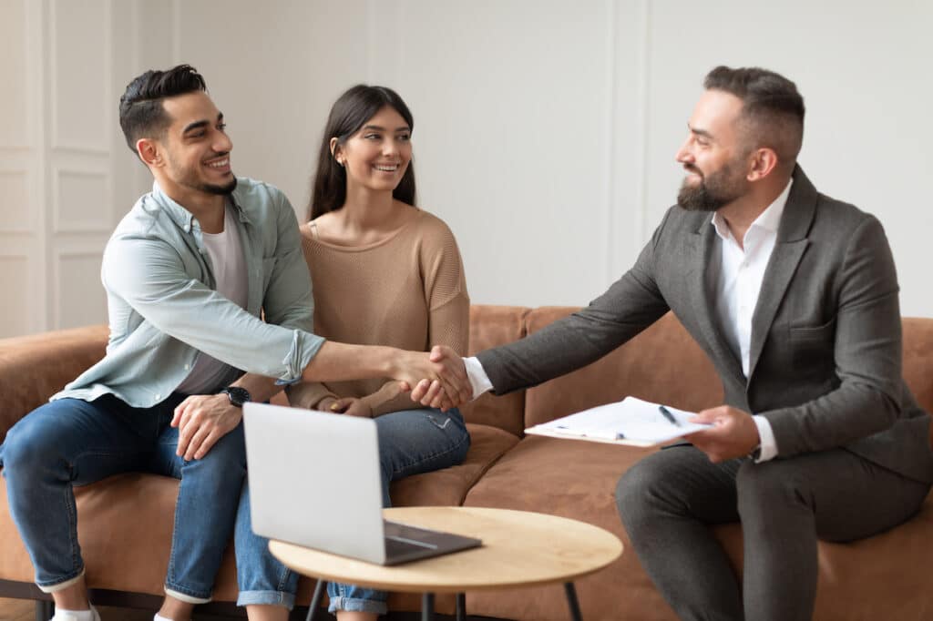 couple buying a house from a realtor