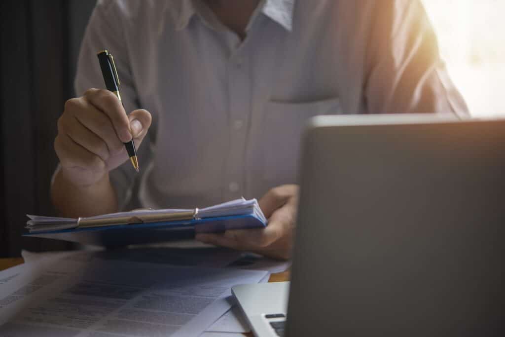 man doing due diligence to buy a business